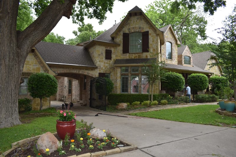 Professional window cleaning at a luxury stone estate in North Dallas, TX