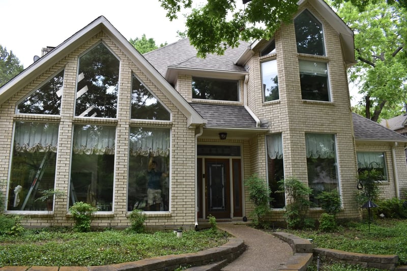 Professional window cleaning on distinctive floor-to-ceiling glass at a North Dallas estate