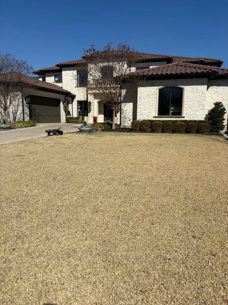 Professional window cleaning equipment at a luxury stone residence in North Dallas