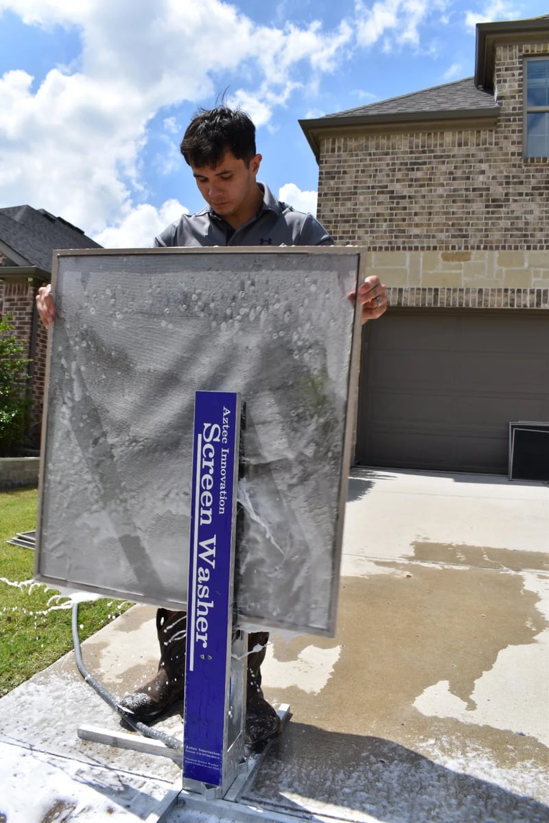 Professional window screen cleaning with a dedicated screen washer at a North Dallas home