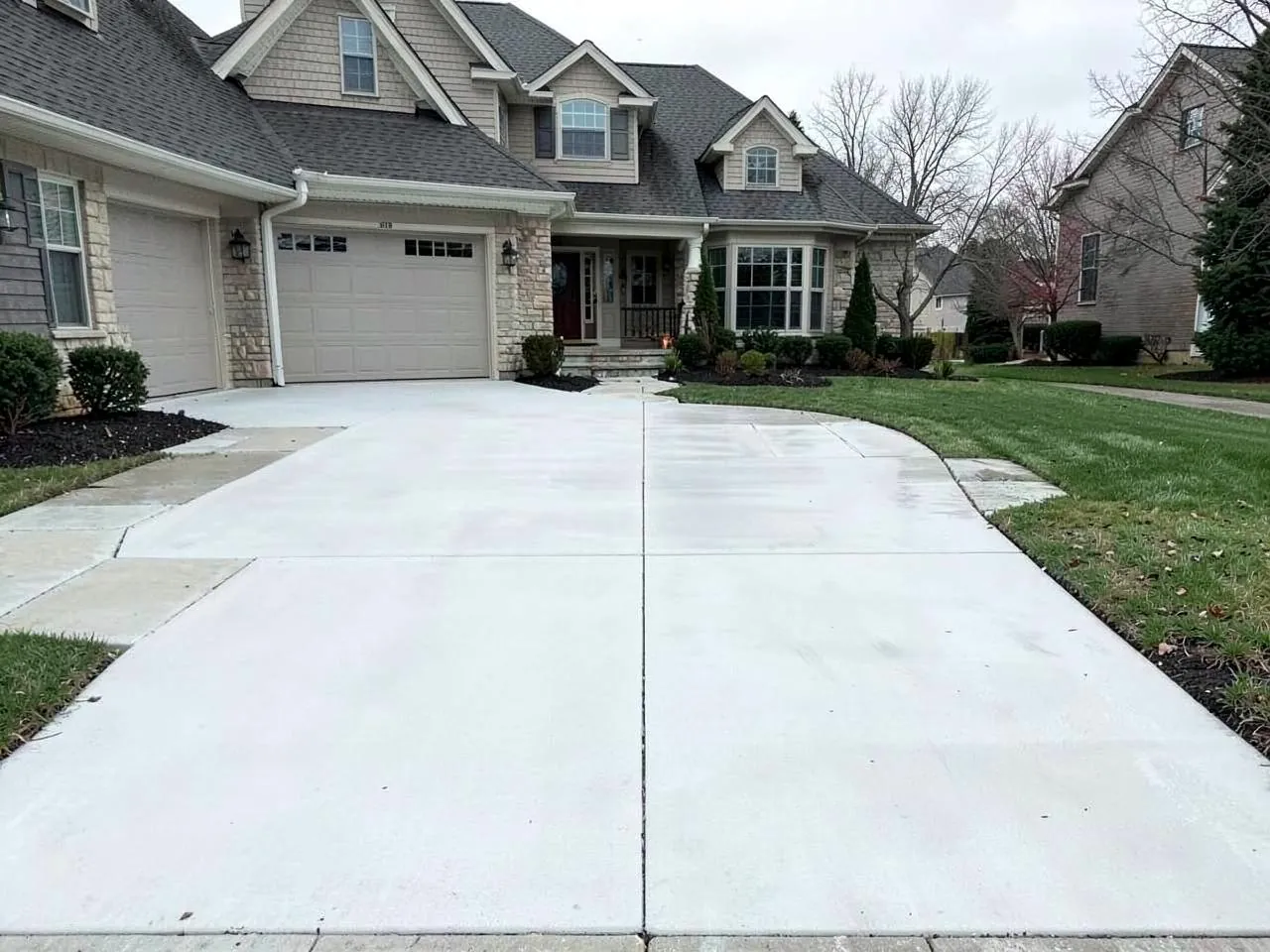 Driveway surface restored after professional pressure washing