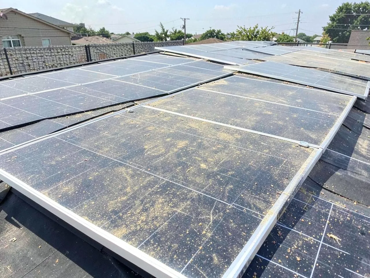 Solar panels before professional cleaning with visible dust and residue